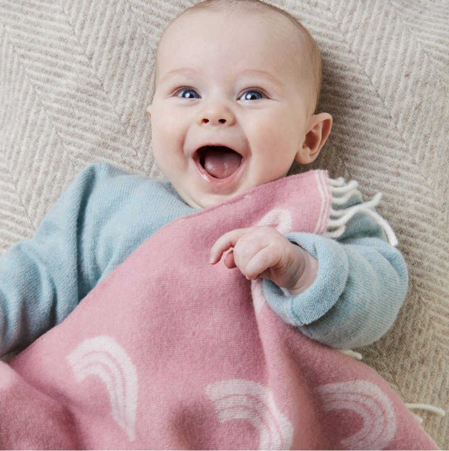 Merino wool rainbow baby blanket lifestyle shot